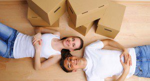two people on the floor with boxes around them