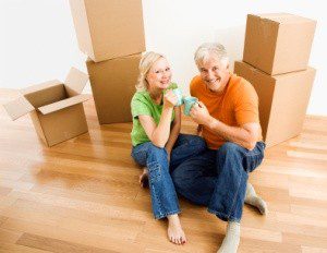 Middle-aged couple sitting on floor